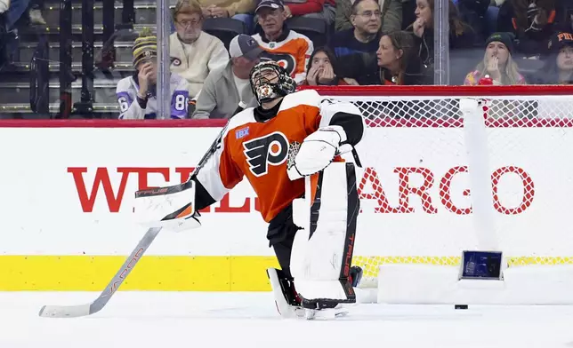 Philadelphia Flyers goaltender Samuel Ersson reacts after giving up a goal to Utah Hockey Club's Logan Cooley during the second period of an NHL hockey game, Sunday, Dec. 8, 2024, in Philadelphia. (AP Photo/Derik Hamilton)