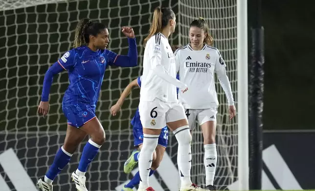 Chelsea's Catarina Macario, left, celebrates after scoring a goal from penalty during the women's Champions League, group B soccer match between Real Madrid and Chelsea at the Alfredo Di Stefano stadium in Madrid, Spain, Tuesday, Dec. 17, 2024. (AP Photo/Manu Fernandez)