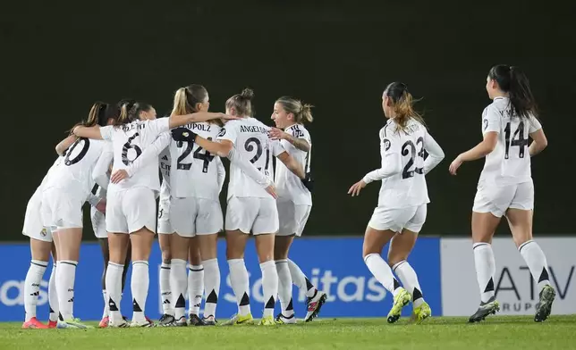 Real Madrid's Caroline Weir, left, celebrates with her teammates after scoring the first goal against Chelsea during the women's Champions League, group B soccer match between Real Madrid and Chelsea at the Alfredo Di Stefano stadium in Madrid, Spain, Tuesday, Dec. 17, 2024. (AP Photo/Manu Fernandez)