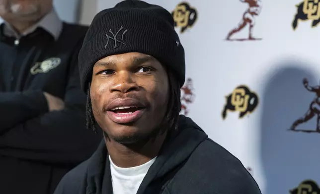 Heisman Trophy finalist Travis Hunter, of Colorado, speaks during a college football media availability, Friday, Dec. 13, 2024, in New York. (AP Photo/Corey Sipkin)