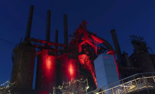 Blast furnaces of the Bethlehem Steel company that once supplied steel for the construction of the Empire State Building and the Golden Gate Bridge, are illuminated next to a Christmas market in Bethlehem, Pa., on Sunday, Dec. 1, 2024.