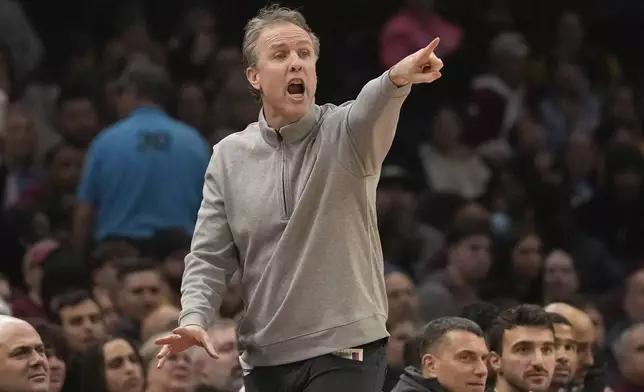 Washington Wizards head coach Brian Keefe gestures in the first half of an NBA basketball game against the Cleveland Cavaliers Friday, Dec. 13, 2024, in Cleveland. (AP Photo/Sue Ogrocki)