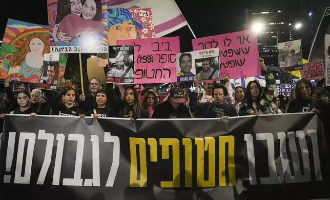 Israelis protest against Prime Minister Benjamin Netanyahu's government and call for the release of hostages held in the Gaza Strip by the Hamas militant group, in Tel Aviv, Israel, Saturday, Dec. 14, 2024. (AP Photo/Tsafrir Abayov)