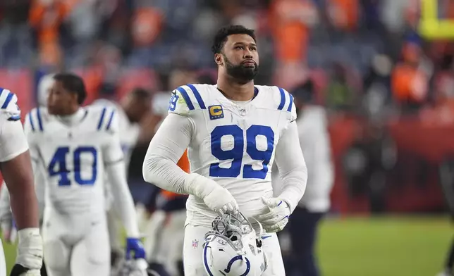 Indianapolis Colts defensive tackle DeForest Buckner heads off the field after an NFL football game against the Denver Broncos Sunday, Dec. 15, 2024, in Denver. (AP Photo/David Zalubowski)