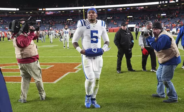 Indianapolis Colts quarterback Anthony Richardson heads off the field after an NFL football game against the Denver Broncos Sunday, Dec. 15, 2024, in Denver. (AP Photo/David Zalubowski)