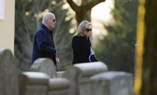 President Joe Biden and first lady Jill Biden arrive at St. Joseph on the Brandywine Catholic Church in Wilmington, Del., on Wednesday, Dec. 18, 2024. Wednesday marks the 52nd anniversary of the car crash that killed Joe Biden's first wife Neilia Hunter Biden and 13-month-old daughter Naomi. (AP Photo/Ben Curtis)