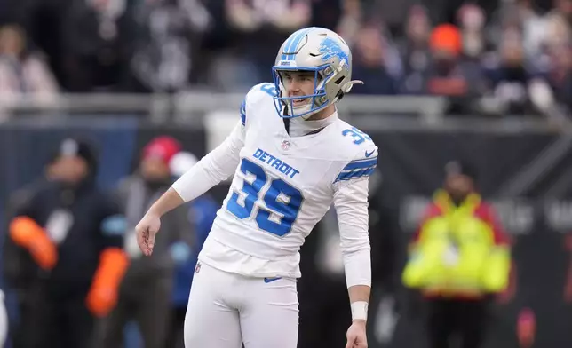 Detroit Lions place kicker Jake Bates watches his 65-yard field goal attempt that missed right during the first half of an NFL football game against the Chicago Bears on Sunday, Dec. 22, 2024, in Chicago. (AP Photo/Erin Hooley)