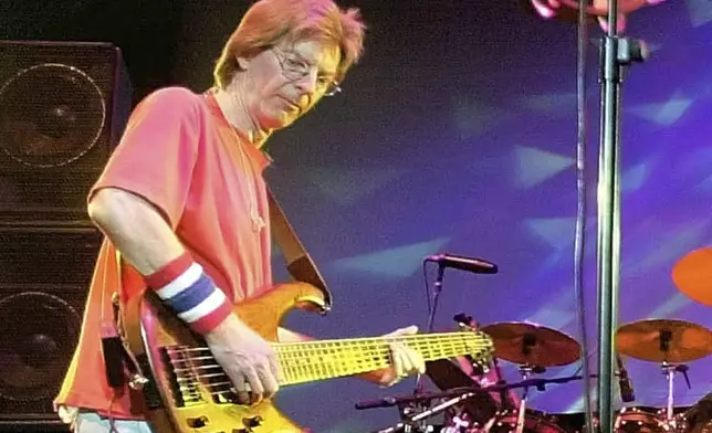 FILE - Phil Lesh, of The Grateful Dead, performs during a reunion concert in East Troy, Wis. on Aug. 3, 2002. (AP Photo/Morry Gash, File)