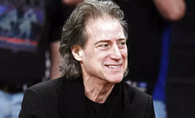 FILE - Comedian Richard Lewis attends an NBA basketball game in Los Angeles on Dec. 25, 2012. (AP Photo/Alex Gallardo, File)