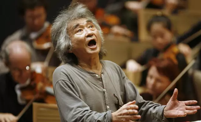 FILE - Former Director of the Boston Symphony Orchestra Seiji Ozawa conducts the orchestra during a rehearsal of Berlioz's "Symphonie Fantastique," at Symphony Hall, in Boston, on Nov. 26, 2008. (AP Photo/Steven Senne, File)