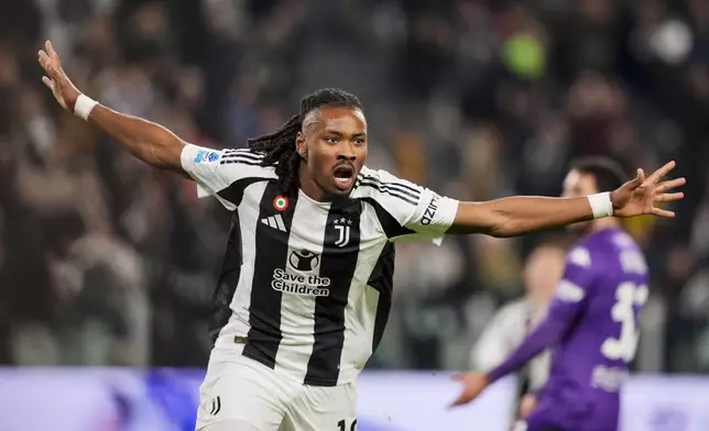 Juventus' Khephren Thuram celebrates after scoring the opening goal during the Serie A soccer match between Juventus Turin and Fiorentina in Turin, Italy, Sunday, Dec. 29, 2024. (Fabio Ferrari/LaPresse via AP)