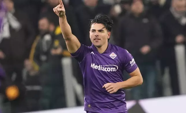 Fiorentina's Riccardo Sottil celebrates after scoring his side's second goal during the Serie A soccer match between Juventus Turin and Fiorentina in Turin, Italy, Sunday, Dec. 29, 2024. (Fabio Ferrari/LaPresse via AP)