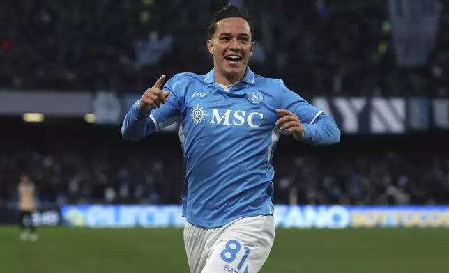 Napoli's Giacomo Raspadori celebrates after scoring the opening goal during the Serie A soccer match between Napoli and Venezia at the Diego Armando Maradona Stadium in Naples, Italy Sunday Dec. 29, 2024. (Alessandro Garofalo/LaPresse via AP)