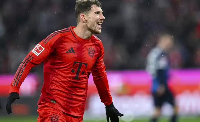 Munich's Leon Goretzka celebrates after scoring his side's third goal during the German Bundesliga soccer match between FC Bayern Munich and 1. FC Heidenheim 1846 in Munich, Germany, Saturday, Dec. 7, 2024. (Sven Hoppe/dpa via AP)