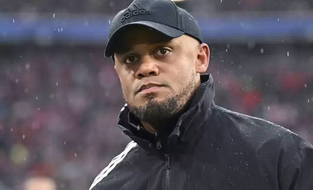 Munich's head coach Vincent Kompany arrives for the German Bundesliga soccer match between FC Bayern Munich and 1. FC Heidenheim 1846 in Munich, Germany, Saturday, Dec. 7, 2024. (Sven Hoppe/dpa via AP)