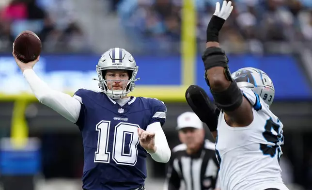 Dallas Cowboys quarterback Cooper Rush passes against the Carolina Panthers during the second half of an NFL football game, Sunday, Dec. 15, 2024, in Charlotte, N.C. (AP Photo/Jacob Kupferman)