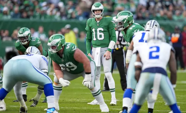 Philadelphia Eagles quarterback Tanner McKee (16) calls a play before taking the snap against the Dallas Cowboys during the second half of an NFL football game, Sunday, Dec. 29, 2024, in Philadelphia. (AP Photo/Chris Szagola)