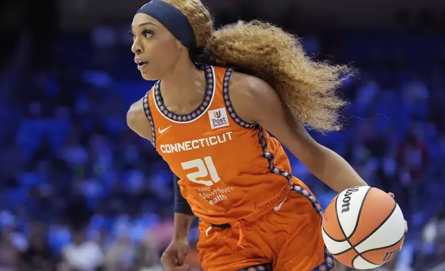 FILE - Connecticut Sun guard DiJonai Carrington drives during the first half of a WNBA basketball basketball game against the Dallas Wings in Arlington, Texas, on June 15, 2024. (AP Photo/LM Otero, File)