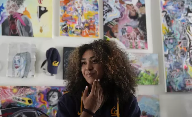 California basketball player Jayda Noble is interviewed in front of her artwork in Berkeley, Calif., Monday, Oct. 21, 2024. (AP Photo/Jeff Chiu)