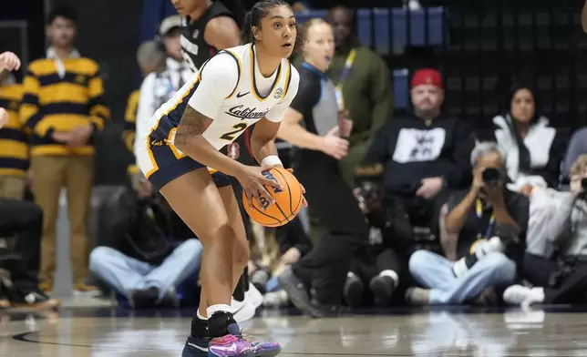 California guard Jayda Noble looks to pass the ball during an NCAA college basketball game against Stanford in Berkeley, Calif., Friday, Dec. 13, 2024. (AP Photo/Jeff Chiu)