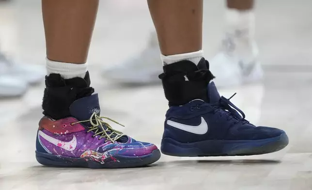 The shoes of California guard Jayda Noble are shown before an NCAA college basketball game against Stanford in Berkeley, Calif., Friday, Dec. 13, 2024. (AP Photo/Jeff Chiu)