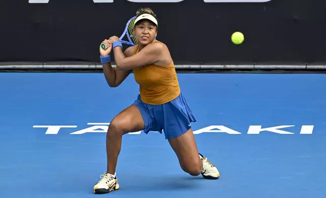 Namoi Osaka of Japan plays a shot against Lina Glushko of Israel during a women's singles match at the ASB Classic tennis tournament at Manuka Doctor Arena in Auckland, New Zealand Monday, Dec. 30, 2024. (Alan Lee/Photosport via AP)