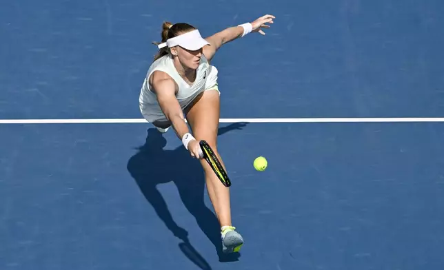 Lina Glushko of Israel plays a shot against Naomi Osaka of Japan during a women's singles match at the ASB Classic tennis tournament at Manuka Doctor Arena in Auckland, New Zealand Monday, Dec. 30, 2024. (Alan Lee/Photosport via AP)