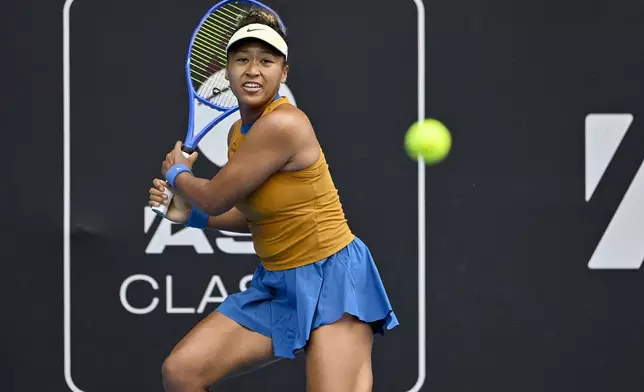 Namoi Osaka of Japan plays a shot against Lina Glushko of Israel during a women's singles match at the ASB Classic tennis tournament at Manuka Doctor Arena in Auckland, New Zealand Monday, Dec. 30, 2024. (Alan Lee/Photosport via AP)