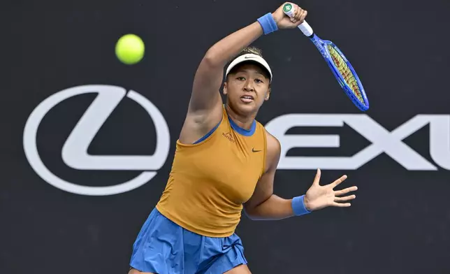 Namoi Osaka of Japan plays a shot against Lina Glushko of Israel during a women's singles match at the ASB Classic tennis tournament at Manuka Doctor Arena in Auckland, New Zealand Monday, Dec. 30, 2024. (Alan Lee/Photosport via AP)