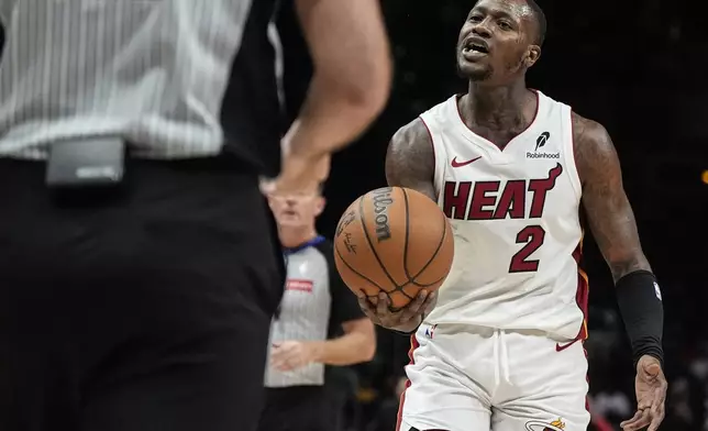 Miami Heat guard Terry Rozier (2) speaks to an official during the first half of an NBA basketball game against the Atlanta Hawks, Saturday, Dec. 28, 2024, in Atlanta. (AP Photo/Mike Stewart)