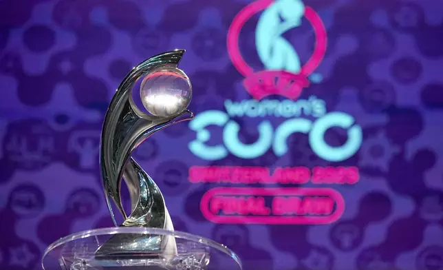 The tournament trophy is on display at the end of the UEFA Euro 2025 European women's soccer championship final draw at the Swiss Tech Convention Centre in Lausanne, Switzerland, Monday, Dec. 16, 2024. (AP Photo/Laurent Cipriani)