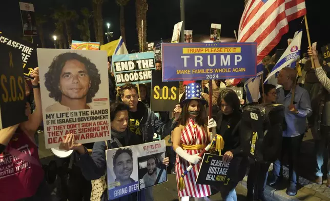 Relatives of hostages held by Hamas in the Gaza Strip and their supporters protest outside of the U.S. Embassy branch office during a visit by White House National Security Adviser Jake Sullivan to call for an immediate hostage release deal, in Tel Aviv, Israel, Thursday, Dec. 12, 2024. (AP Photo/Ariel Schalit)