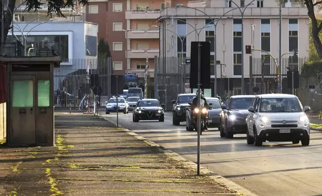 The motorcade escorting Pope Francis arrives at the Rebibbia Prison where the Pontiff symbolically opens a Holy Door with inmates in Rome, Thursday, Dec. 26, 2024. (AP Photo/Gregorio Borgia)