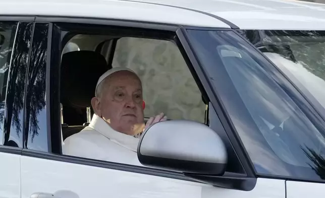 Pope Francis arrives at Rebibbia prison for the event of the opening of the Holy Door of the chapel at the prison in Rome, Thursday, Dec. 26, 2024. (AP Photo/Gregorio Borgia)