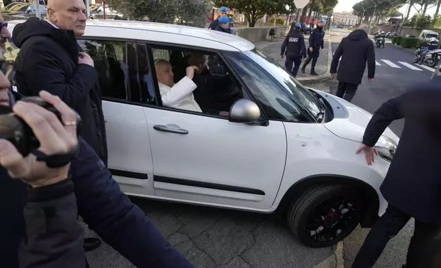 Pope Francis leaves the Rebibbia Prison where he symbolically opened a Holy Door with inmates in Rome, Thursday, Dec. 26, 2024. (AP Photo/Gregorio Borgia)