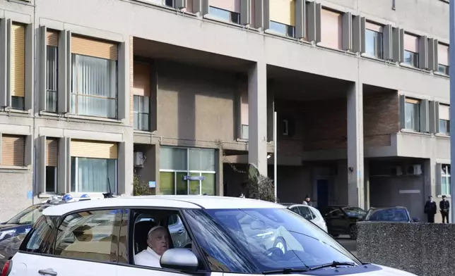 Pope Francis leaves the Rebibbia Prison where he symbolically opened a Holy Door with inmates in Rome, Thursday, Dec. 26, 2024. (AP Photo/Gregorio Borgia)