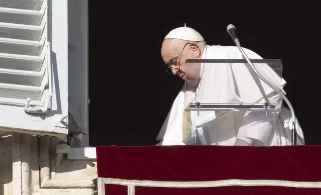 Pope Francis leaves after he recited the Angelus noon prayer from the window of his studio overlooking St.Peter's Square, at the Vatican, Thursday, Dec. 26, 2024. (AP Photo/Andrew Medichini)