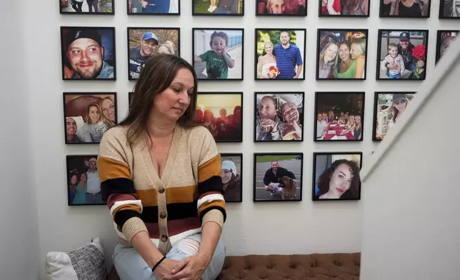 Jen Dold, whose brother, Alex Dold, lived with schizophrenia and died after a 2017 encounter with sheriff's deputies and police officers, sits for a portrait at her home Wednesday, Sept. 18, 2024, in Edmonds, Wash. (AP Photo/Lindsey Wasson)