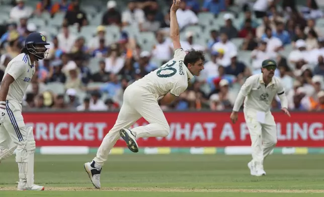 Australia's captain Pat Cummins bowls a delivery during the day one of the second cricket test match between Australia and India at the Adelaide Oval in Adelaide, Australia, Friday, Dec. 6, 2024. (AP Photo/James Elsby)