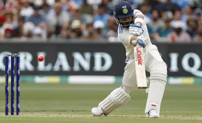 India's Virat Kohli plays a shot during the day one of the second cricket test match between Australia and India at the Adelaide Oval in Adelaide, Australia, Friday, Dec. 6, 2024. (AP Photo/James Elsby)