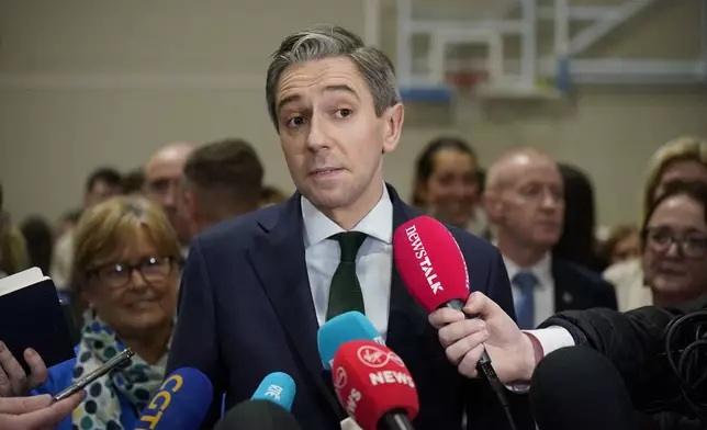 Taoiseach and Fine Gael leader Simon Harris speaks to the media as he arrives at the election count centre at Shoreline Leisure Greystones in Co Wicklow, after the General Election, Saturday, Nov. 30, 2024. (Niall Carson/PA via AP)