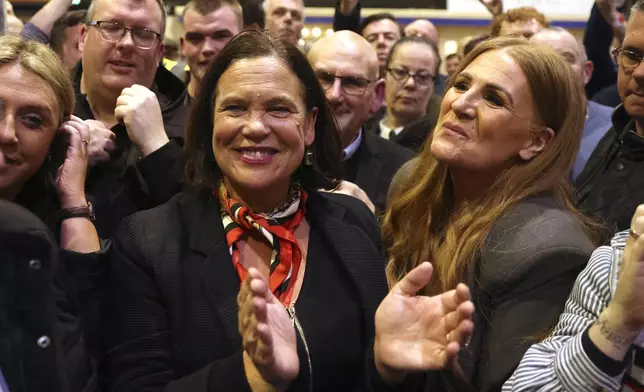 Sinn Fein president Mary Lou McDonald celebrates with supporters after arriving at the count at the Royal Dublin Society in Dublin, Saturday, Nov. 30, 2024.(AP Photo/Peter Morrison)