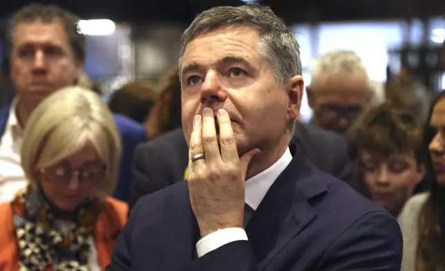 Fine Gael politician Paschal Donohoe pauses at RDS, the Royal Dublin Society, after voters went to the polls during Ireland's election in Dublin, Sunday, Dec. 1, 2024.(AP Photo/Peter Morrison)