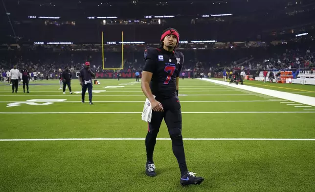 Houston Texans quarterback C.J. Stroud walks off the field after an NFL football game against the Baltimore Ravens, Wednesday, Dec. 25, 2024, in Houston. (AP Photo/Eric Christian Smith)