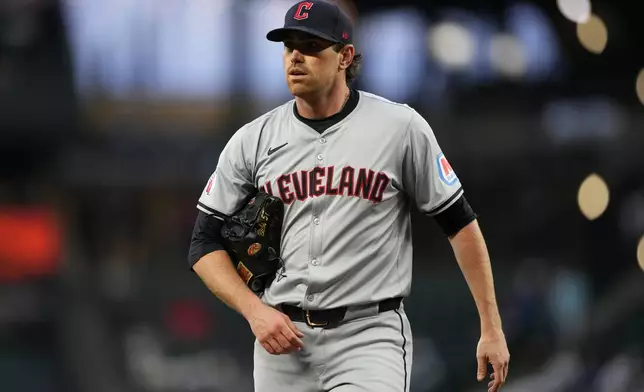 FILE - Cleveland Guardians starting pitcher Shane Bieber walks back to the dugout after throwing against the Seattle Mariners in a baseball game Tuesday, April 2, 2024, in Seattle. (AP Photo/Lindsey Wasson, File)