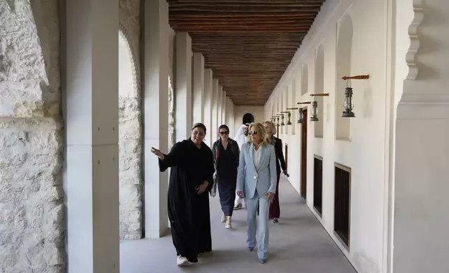 First lady Jill Biden, right, visits Kasr Al Hosn Fort, in Abu Dhabi, United Arab Emirates, Thursday, Dec. 5, 2024. (AP Photo/Altaf Qadri)