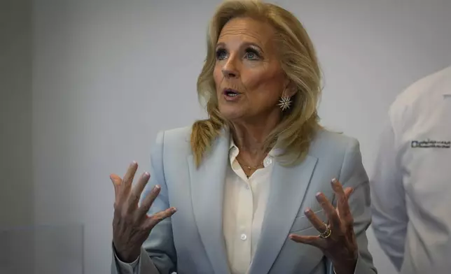 First lady Jill Biden speaks during a visit to Cleveland Clinic in Abu Dhabi, United Arab Emirates, Thursday, Dec. 05, 2024. (AP Photo/Altaf Qadri)