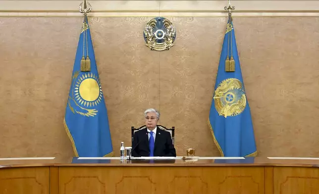 In this photo released by Kazakhstan's Presidential Press Office, Kazakh President Kassym-Jomart Tokayev speaks during a meeting in Astana, Kazakhstan, on Saturday, Dec. 28, 2024, in connection with the Azerbaijan Airlines Embraer 190 that crashed near the Kazakhstan's airport of Aktau. (Kazakhstan's Presidential Press Office via AP)