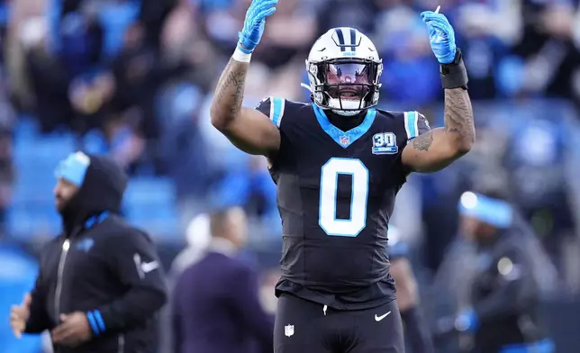 Carolina Panthers tight end Ja'Tavion Sanders celebrates their overtime win against the Arizona Cardinals in an NFL football game, Sunday, Dec. 22, 2024, in Charlotte, N.C. (AP Photo/Jacob Kupferman)