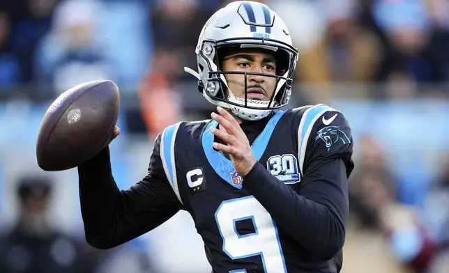 Carolina Panthers quarterback Bryce Young passes against the Arizona Cardinals during the second half of an NFL football game, Sunday, Dec. 22, 2024, in Charlotte, N.C. (AP Photo/Jacob Kupferman)